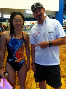 Sean Anthony enjoys a smile with swimmer Natsumi Hoshi, bronze medalist in the 200-meter butterfly at the 2012 London Olympics. Hoshi is wearing a swimsuit featuring a design of Italian swimmer Federica Pellegrini, who has also spent a lot of time training in Flagstaff over the years. 　COURTESY PHOTO